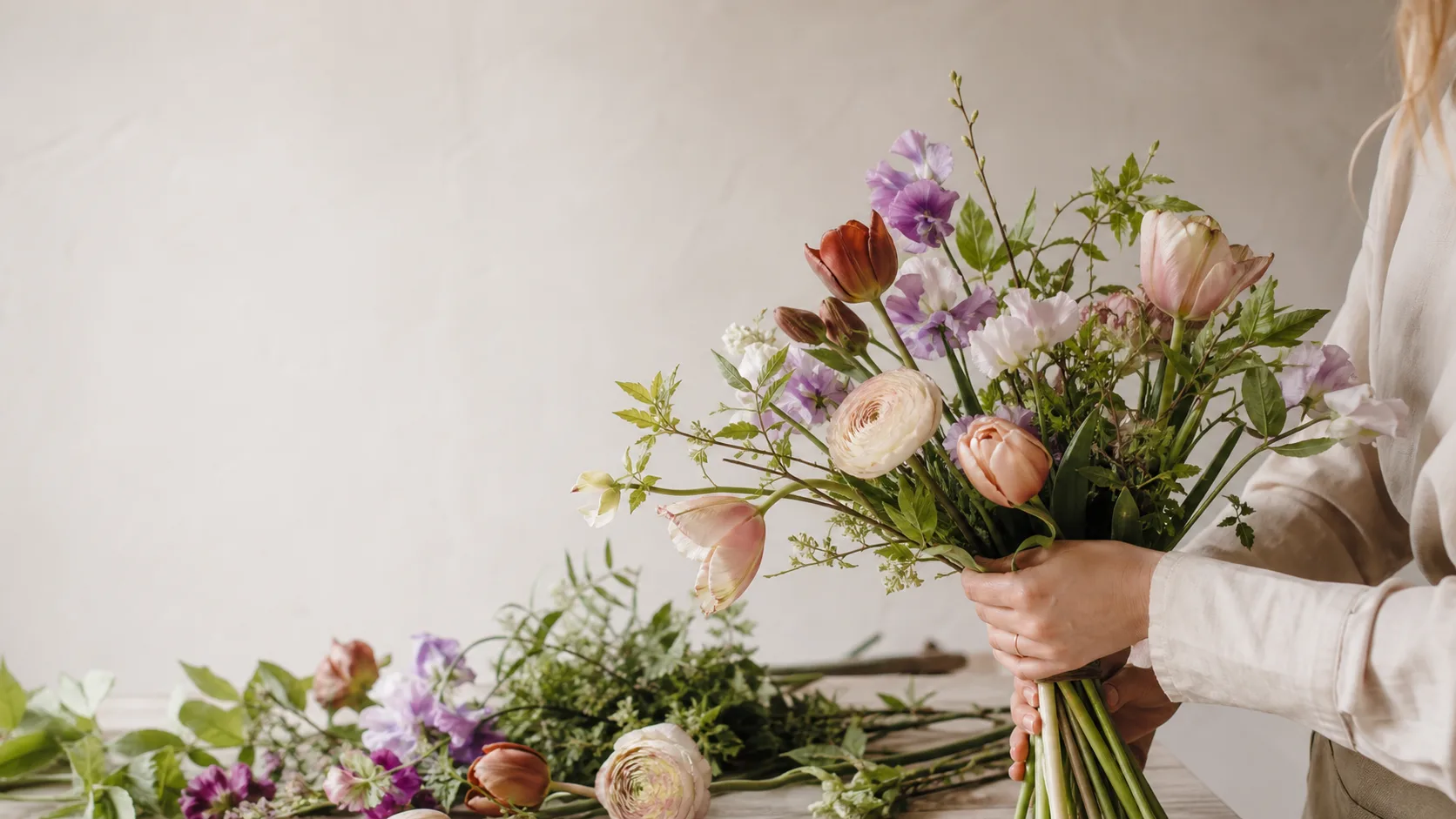 Seasonal flowers being arranged